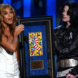 Beyoncé presents the Humanitarian Award to Michael Jackson at the 2003 Radio Music Awards held at the Aladdin Hotel and Casino in Las Vegas, Nevada, on October 27, 2003.