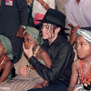 Michael Jackson sits with orphaned and abandoned Ivory Coast children February 16, 1992