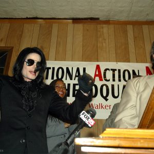 Michael Jackson cheers Reverend Al Sharpton at National Action Network headquarters in Harlem neighborhood of New York, NY, July 6, 2002