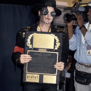 Michael Jackson receives Guinness World Records Lifetime Achievement Award and a plaque from Michael Jackson Observer Fan Club on on May 19, 1993