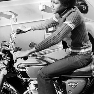 Michael Jackson on Honda motorcycle at home in Los Angeles for Right On! magazine December 18, 1972