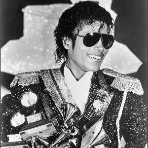 Michael Jackson with awards he won at the 26th Annual GRAMMY Awards, February 28, 1984 at the Shrine Auditorium in Los Angeles, California.