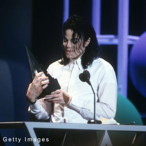 Michael Jackson accepts one of three awards that he won at the 20th Annual American Music Awards on January 25, 1993.