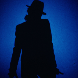 Michael Jackson on stage in silhouette.